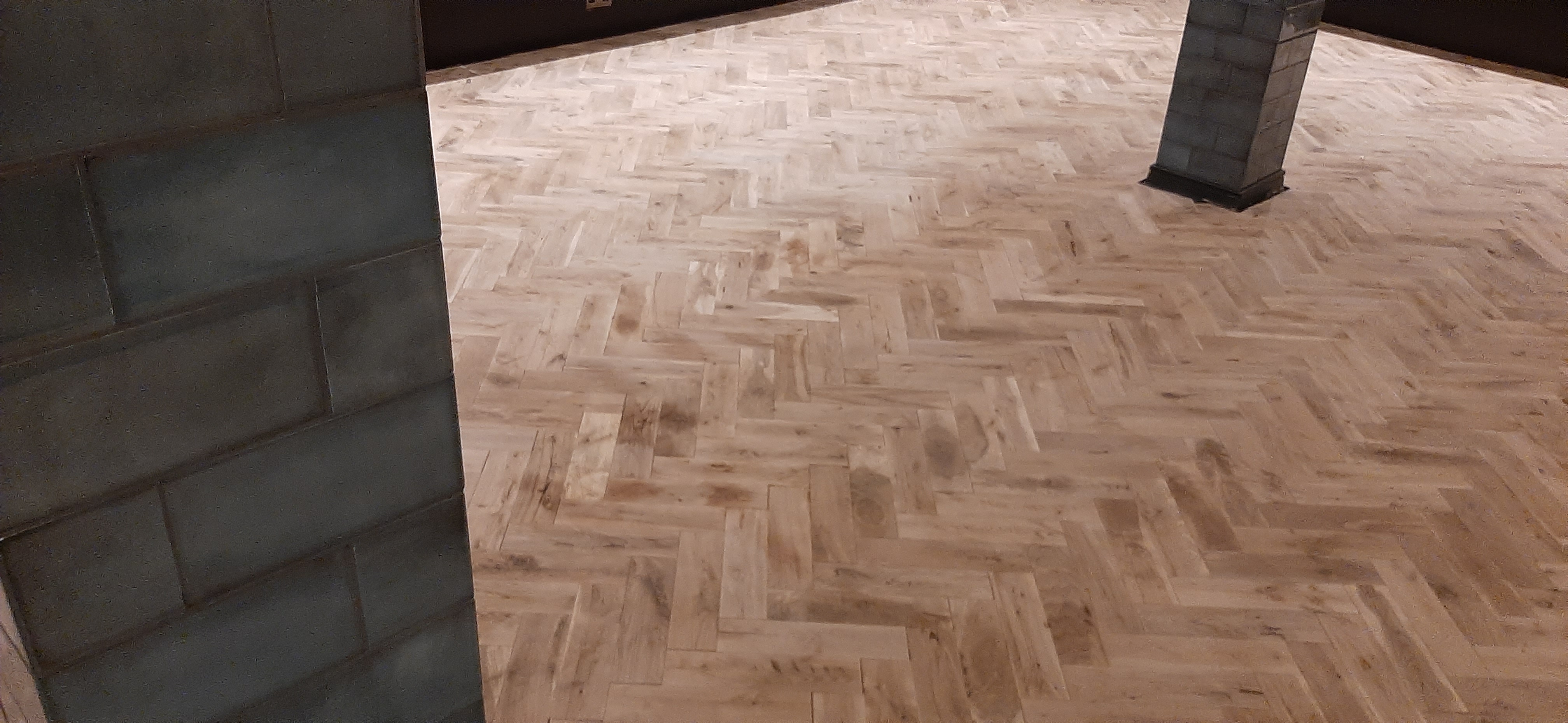 Professional installation of new hardwood flooring in Central London.